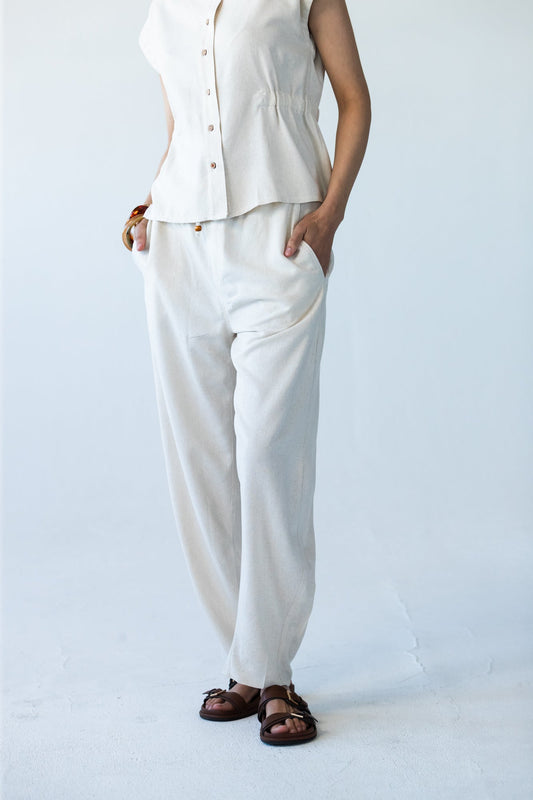 Parker stone barrel pants, close up front view with hands in pockets