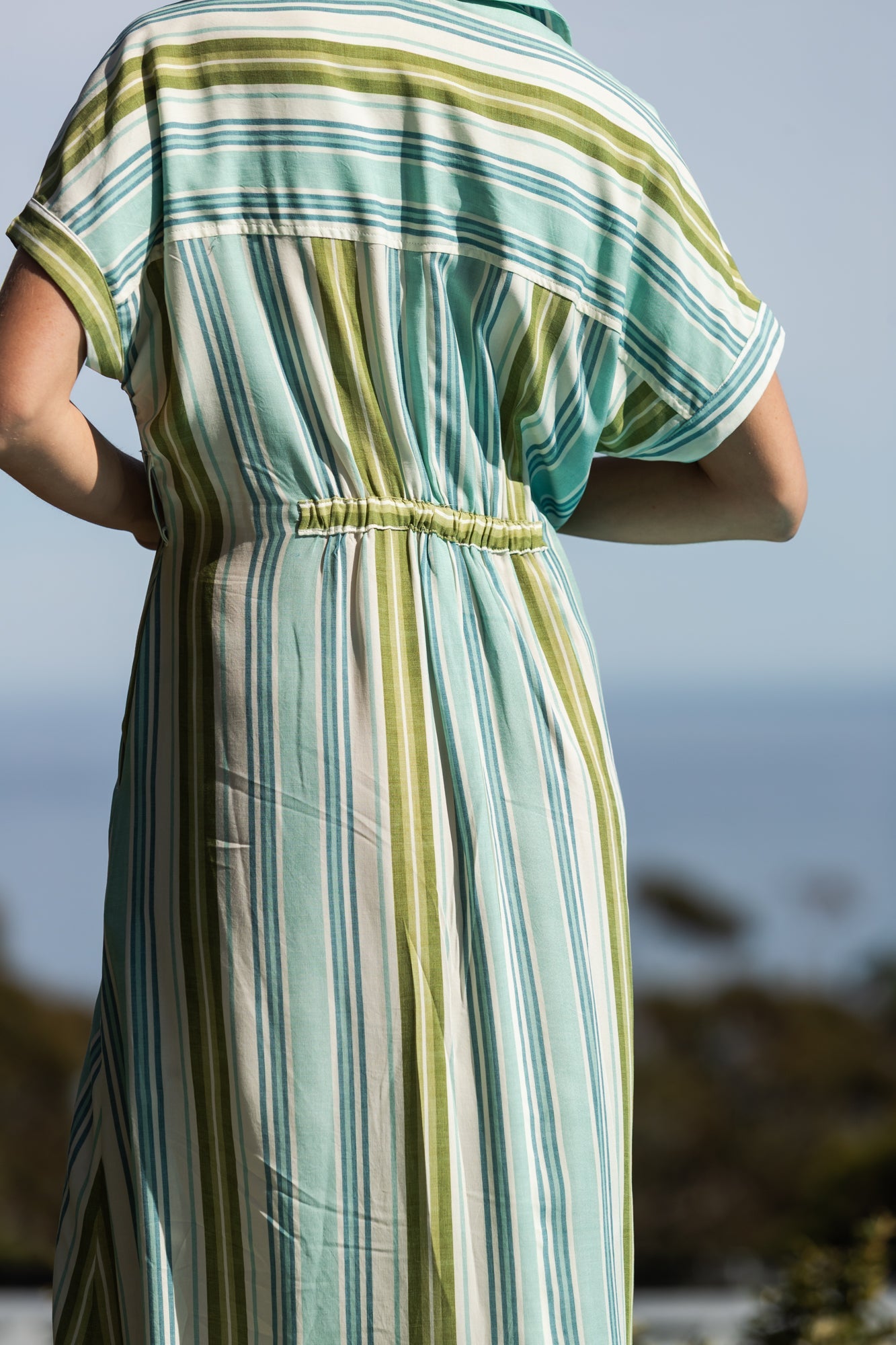 Quinn blue green stripe dress, close up of elasticated back panel, outdoor shot