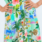Quinn mint lemon dress, close up of pleated waist and button placket, hands on hips