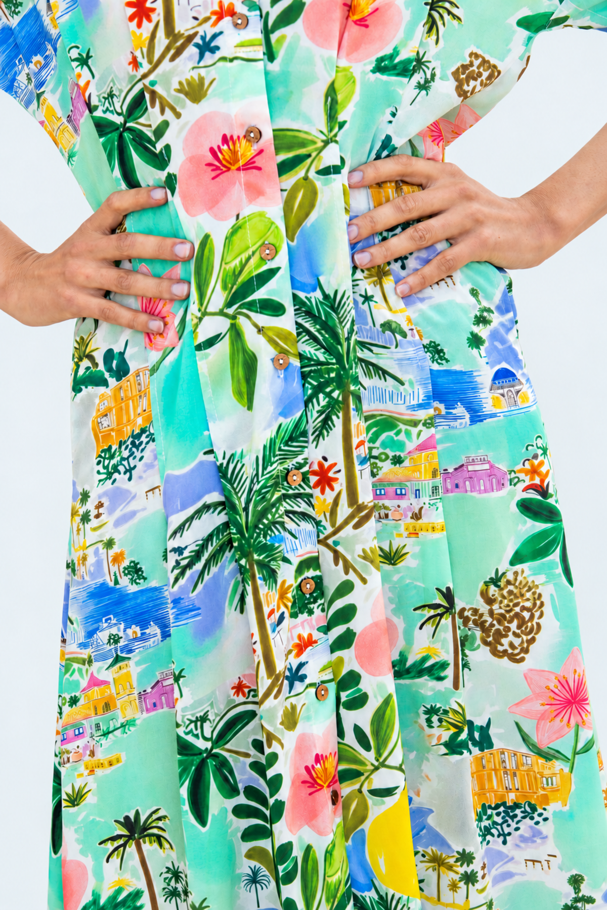 Quinn mint lemon dress, close up of pleated waist and button placket, hands on hips