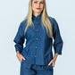 Kinsley denim kaftan-style shirt, front view with hands in pockets, styled with Parker pants