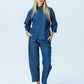 Parker denim barrel pants, front view full length with hands in pockets, styled with the Kinsley