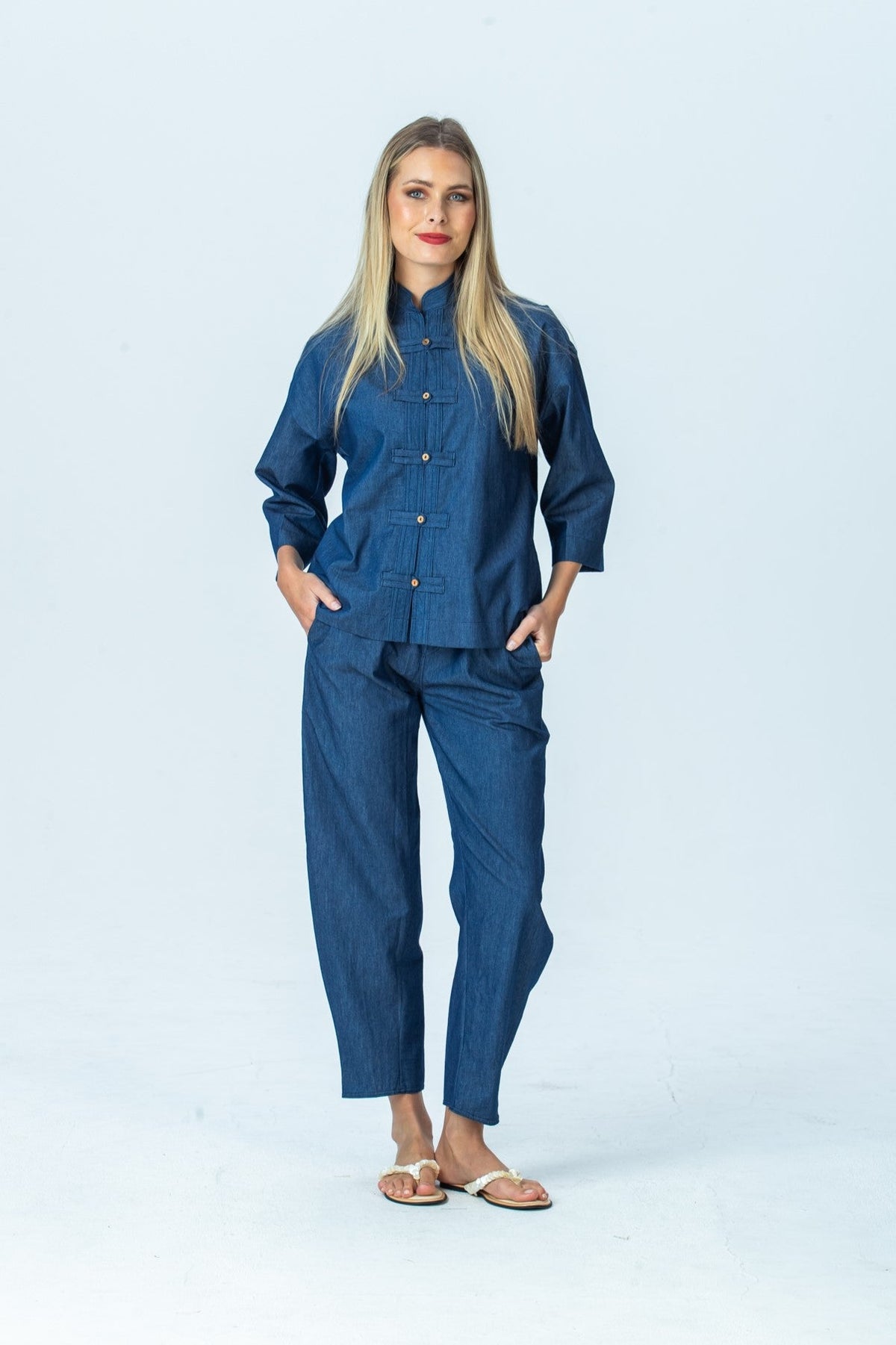 Parker denim barrel pants, front view full length with hands in pockets, styled with the Kinsley