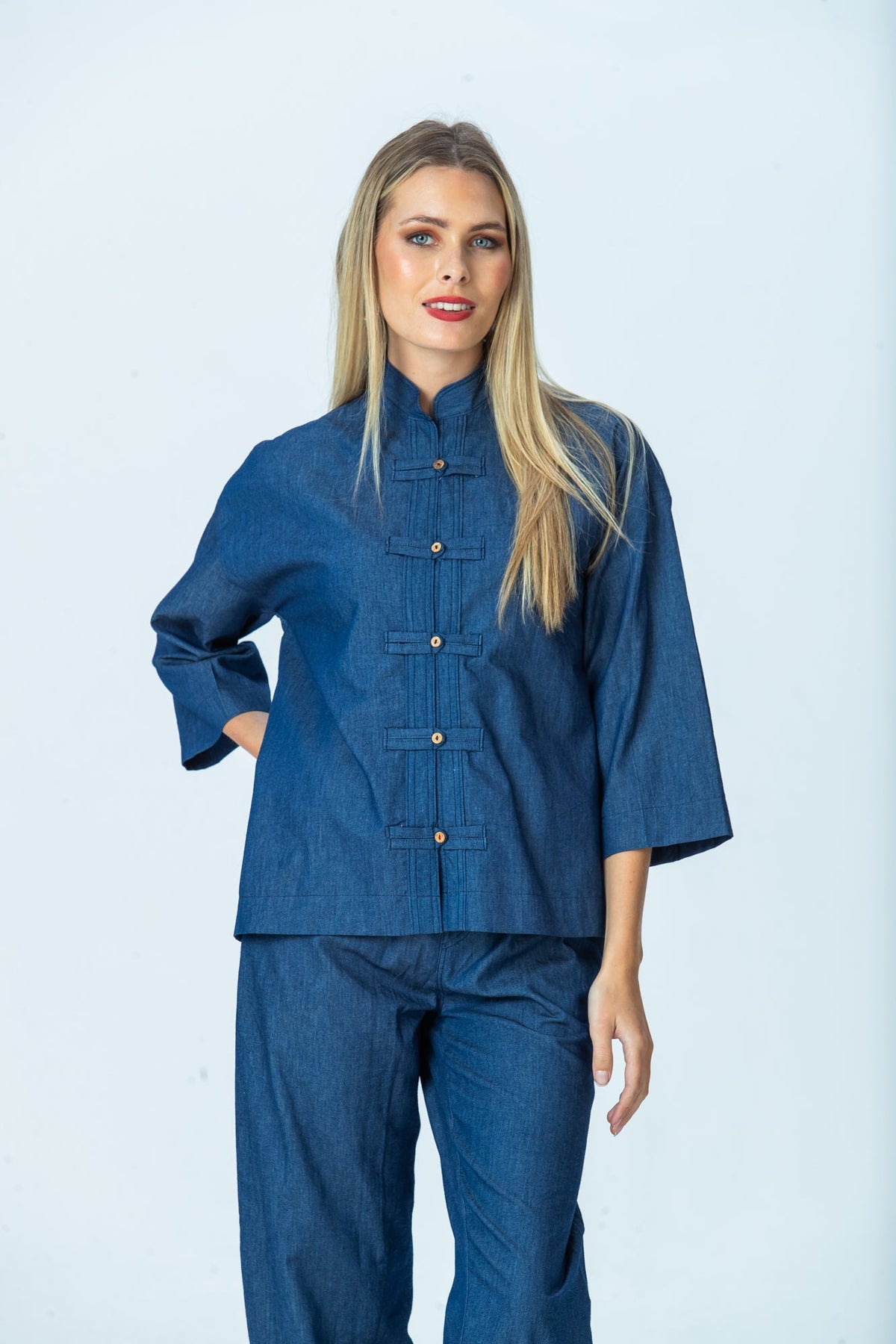 Kinsley denim kaftan-style shirt, front view with hand behind back