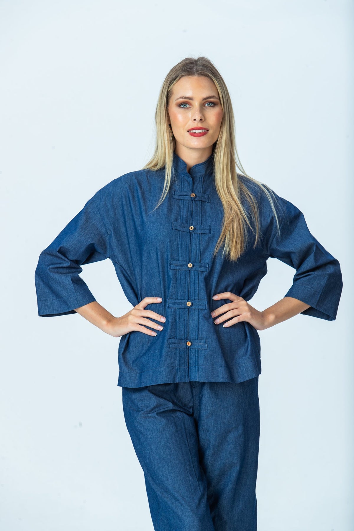 Kinsley denim kaftan-style shirt, front view with hands on hips