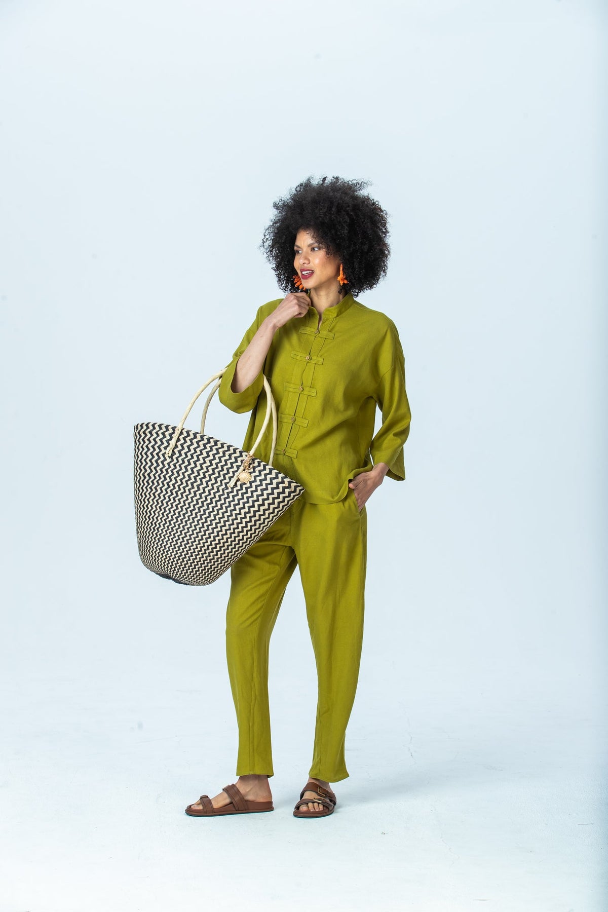 Parker chartreuse barrel pants, front view full length with hand in pocket