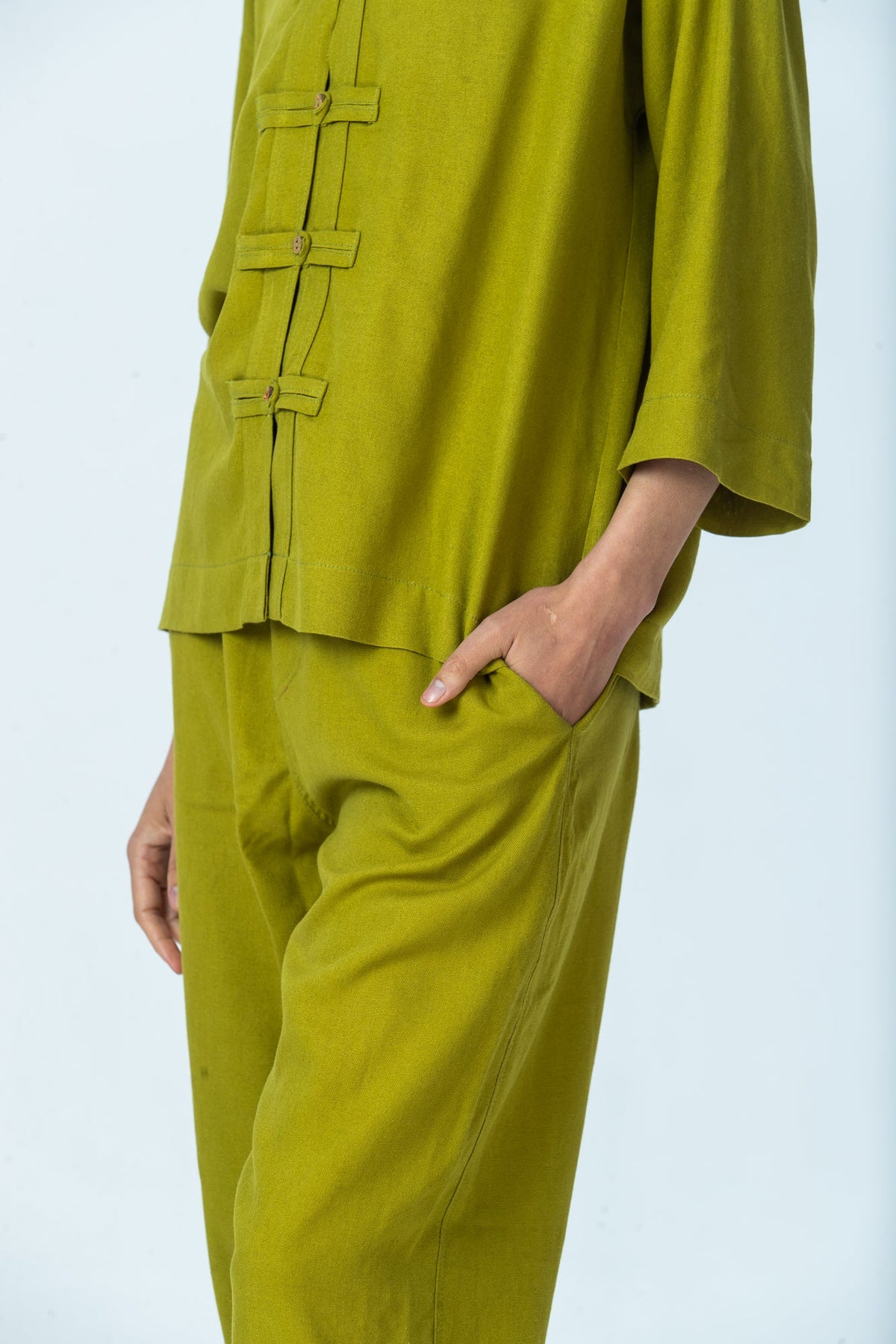 Parker chartreuse barrel pants, close up of pocket and barrel leg