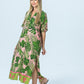 Bailey pink tropical kaftan, three-quarter view full length walking