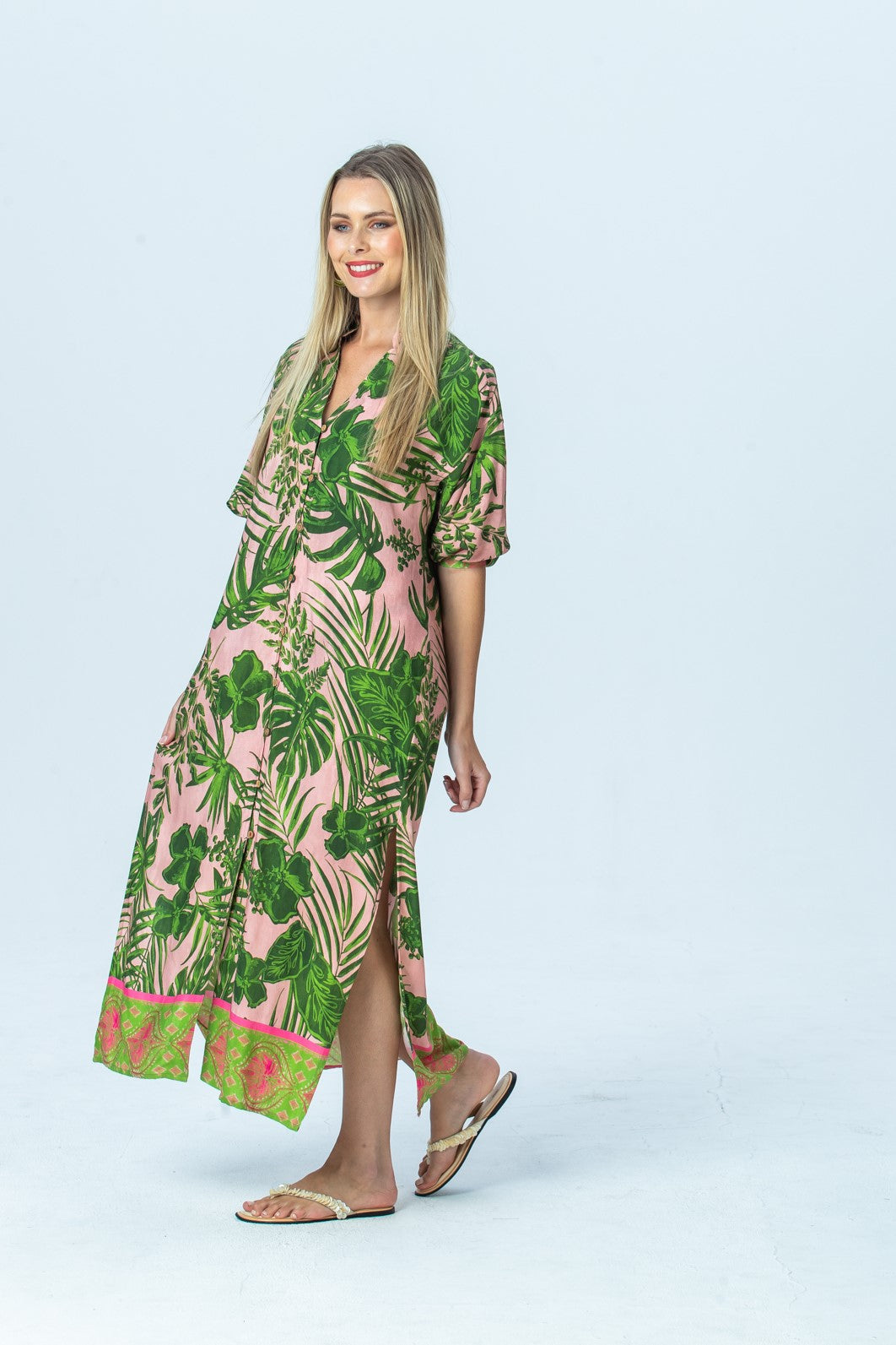 Bailey pink tropical kaftan, three-quarter view full length walking