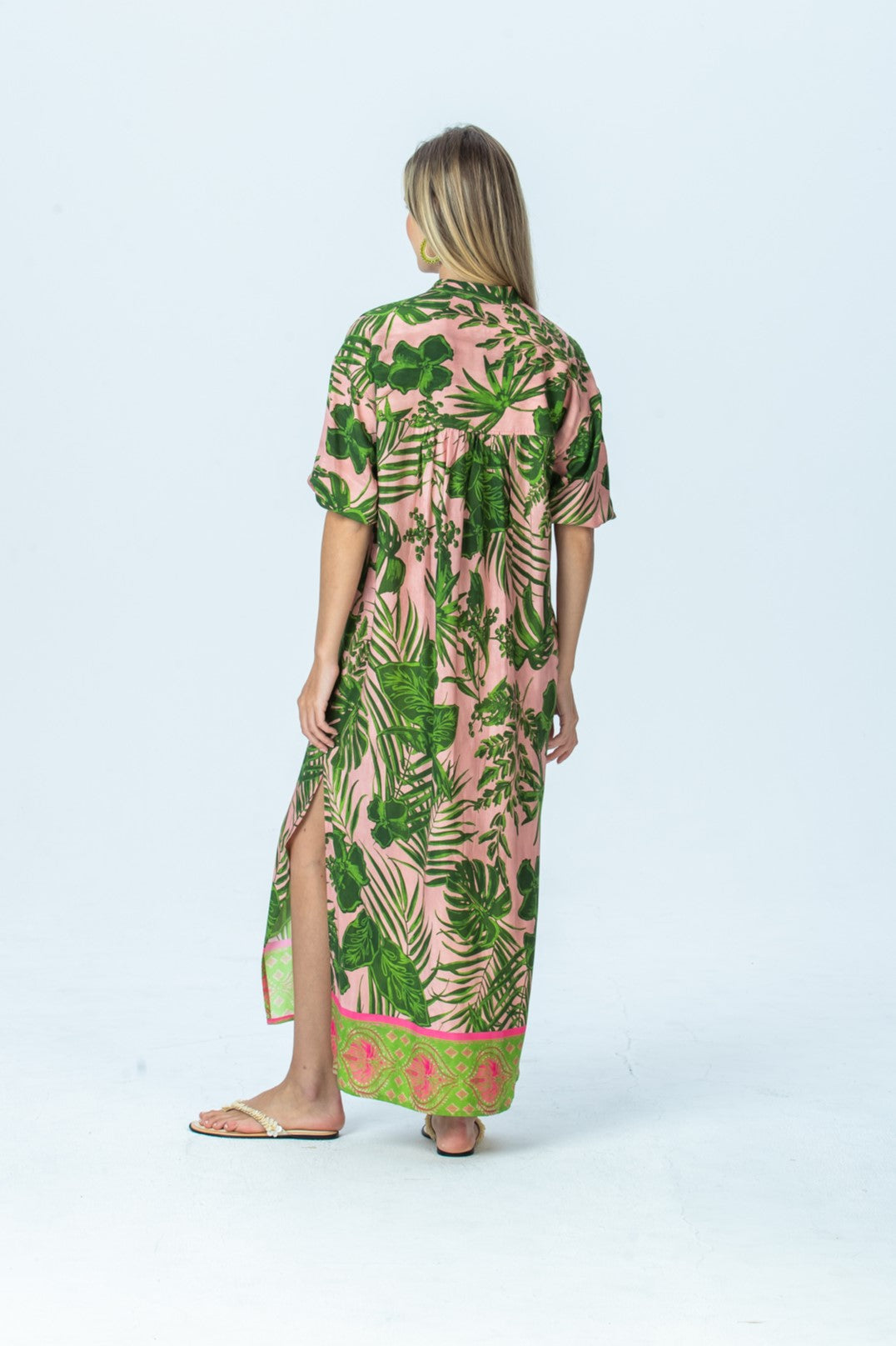 Bailey pink tropical kaftan, back view full length showing the side slit and border hem