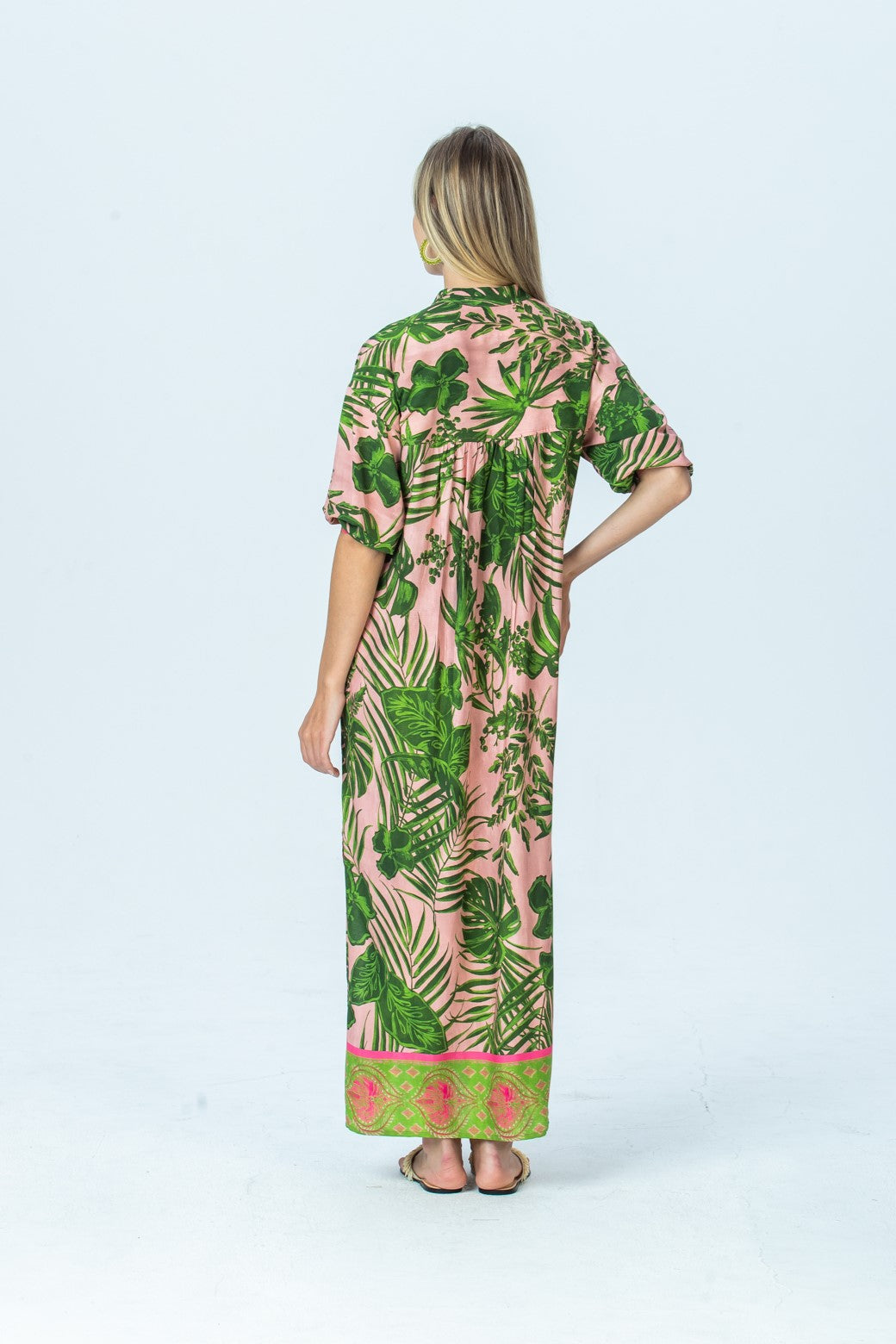 Bailey pink tropical kaftan, back view full length with hand on hip