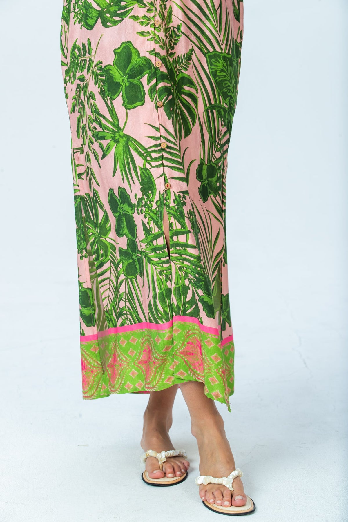 Bailey pink tropical kaftan, close up of lime and pink border hem and side slits