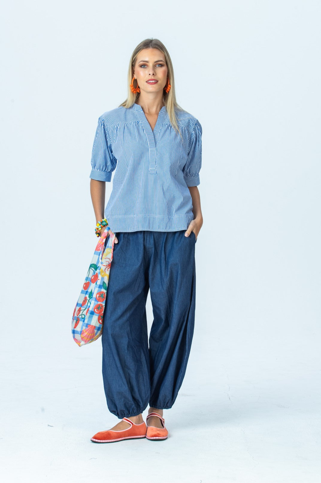 Tatum blue stripe shirt, front view full length with Stella balloon pants