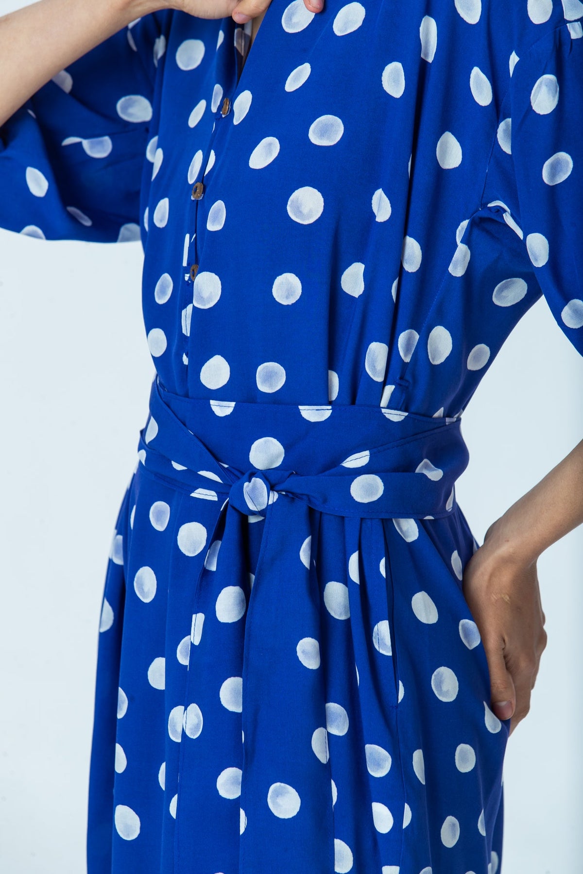 Sloane royal blue polka dot dress, close up of placket and self-tie belt