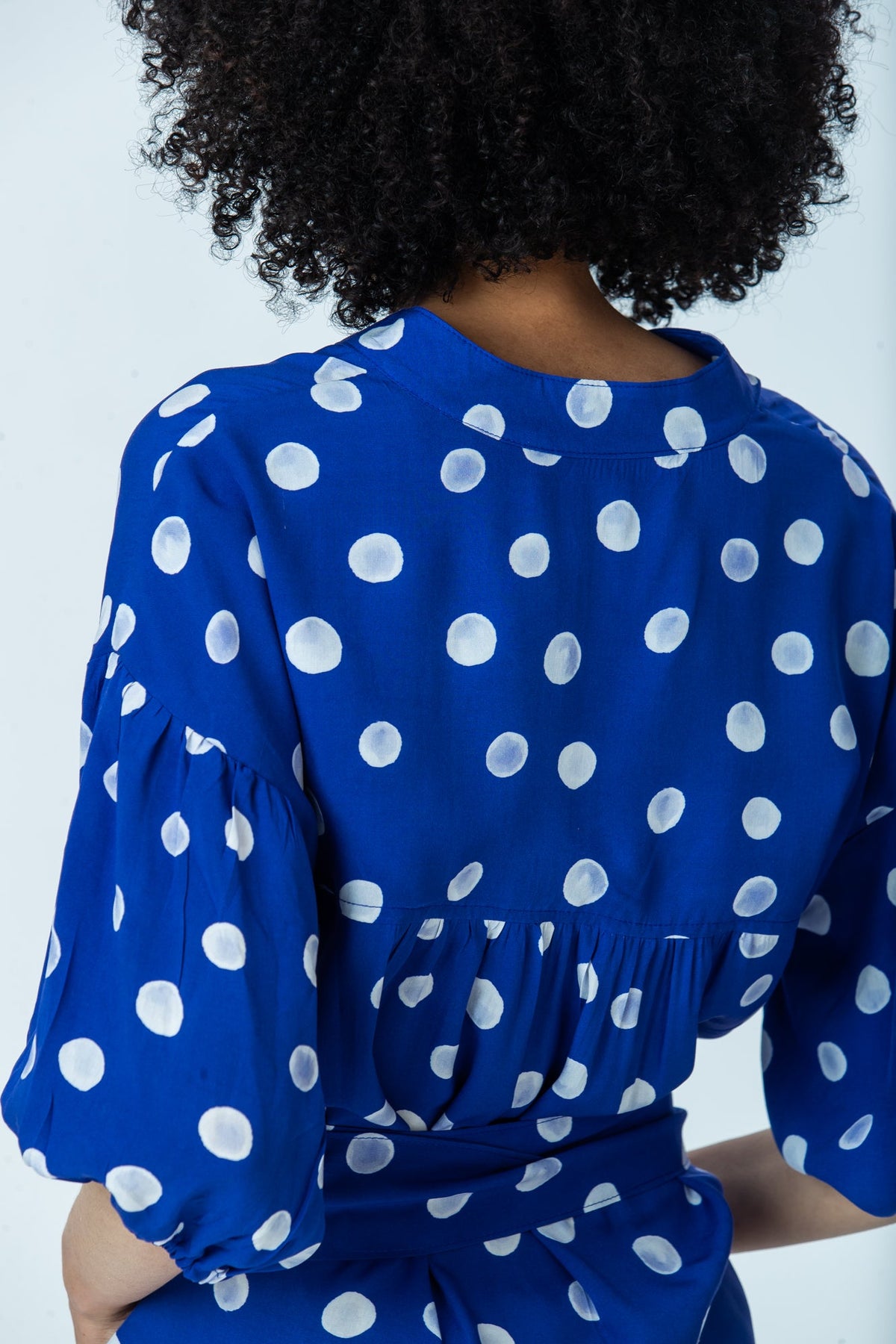 Sloane royal blue polka dot dress, back view close up of collar, gathered back yoke and sleeve