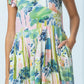 Sienna watercolour palm sundress, close up of pleated skirt and pocket