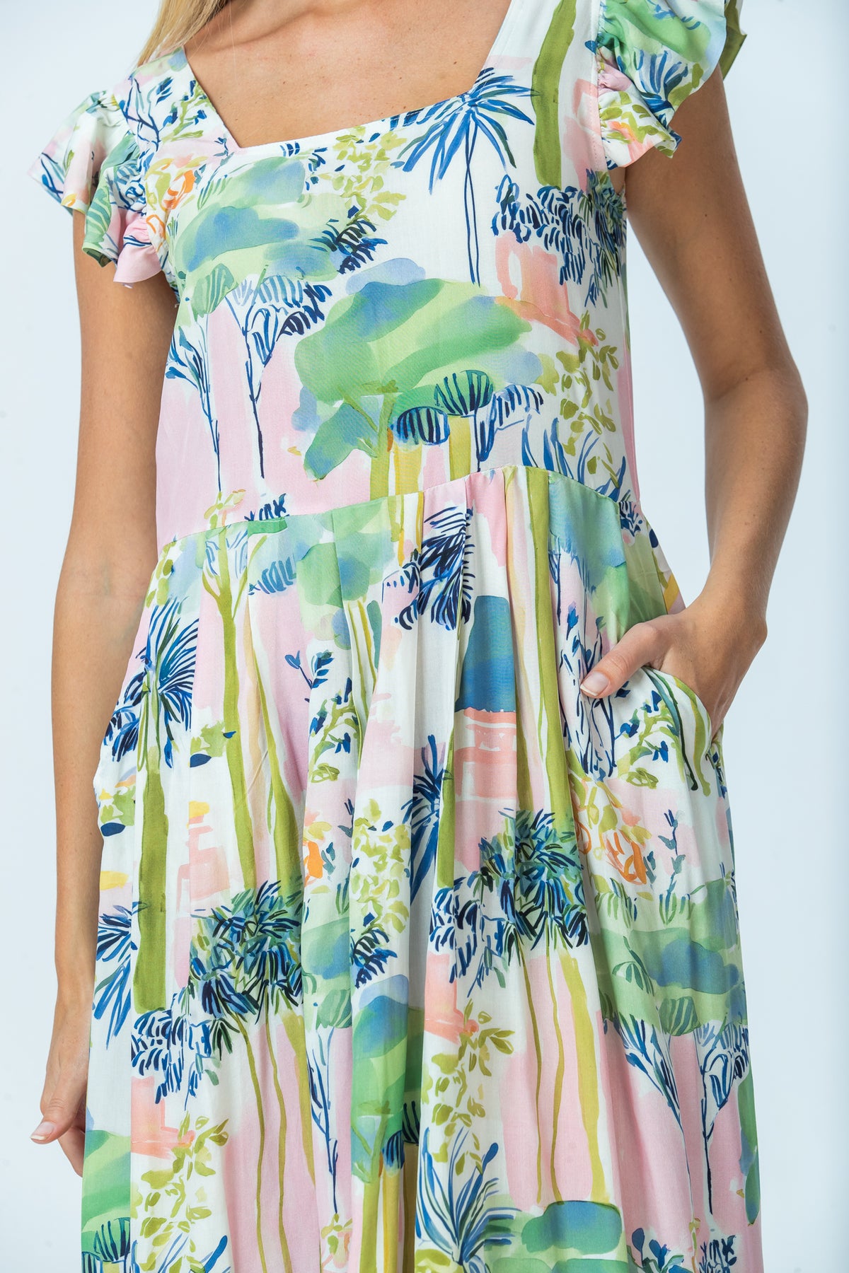 Sienna watercolour palm sundress, close up of pleated skirt and pocket