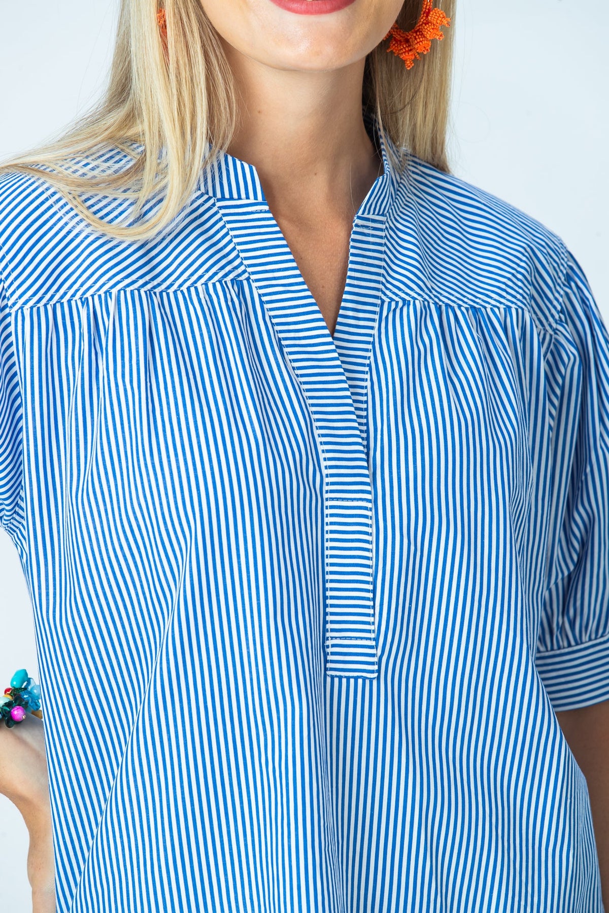Tatum blue stripe shirt, close up of horizontal stripe placket and gathered yoke