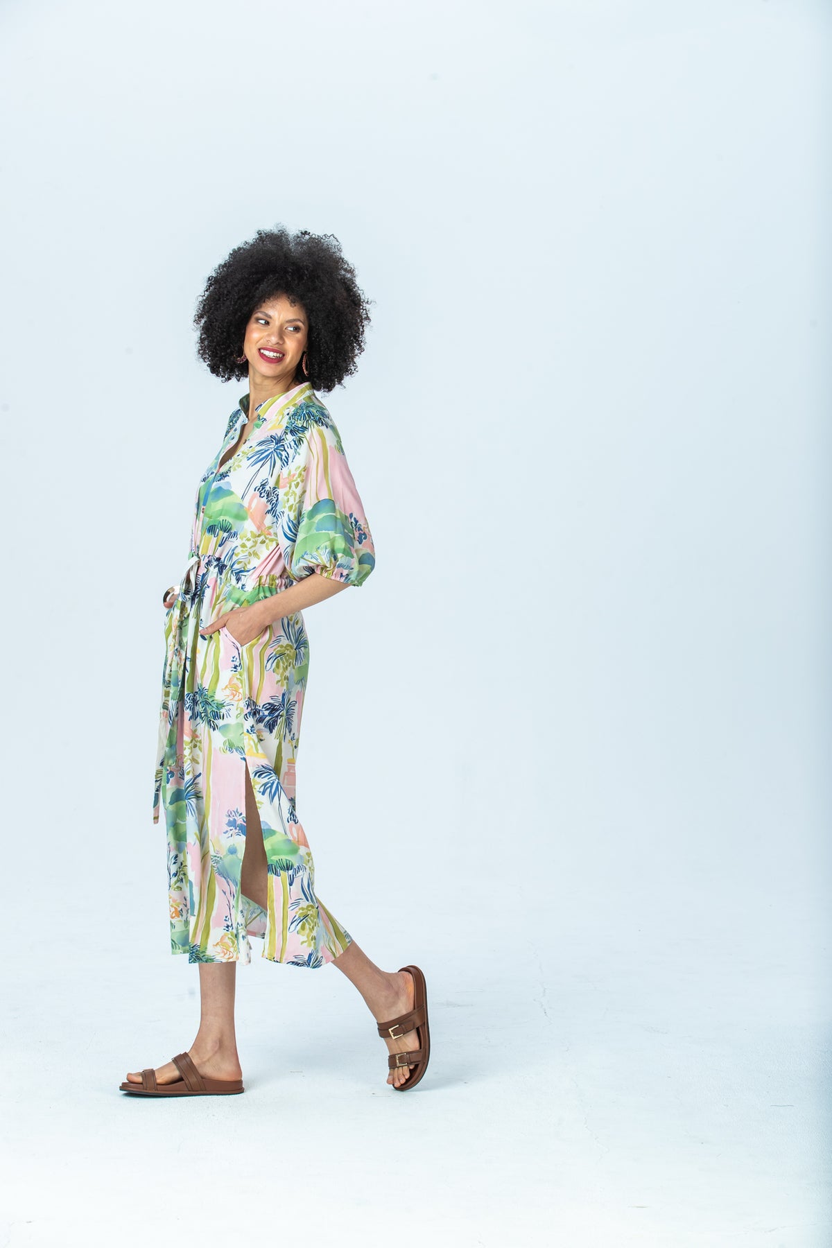Shelby watercolour palm dress, side view walking showing side slit