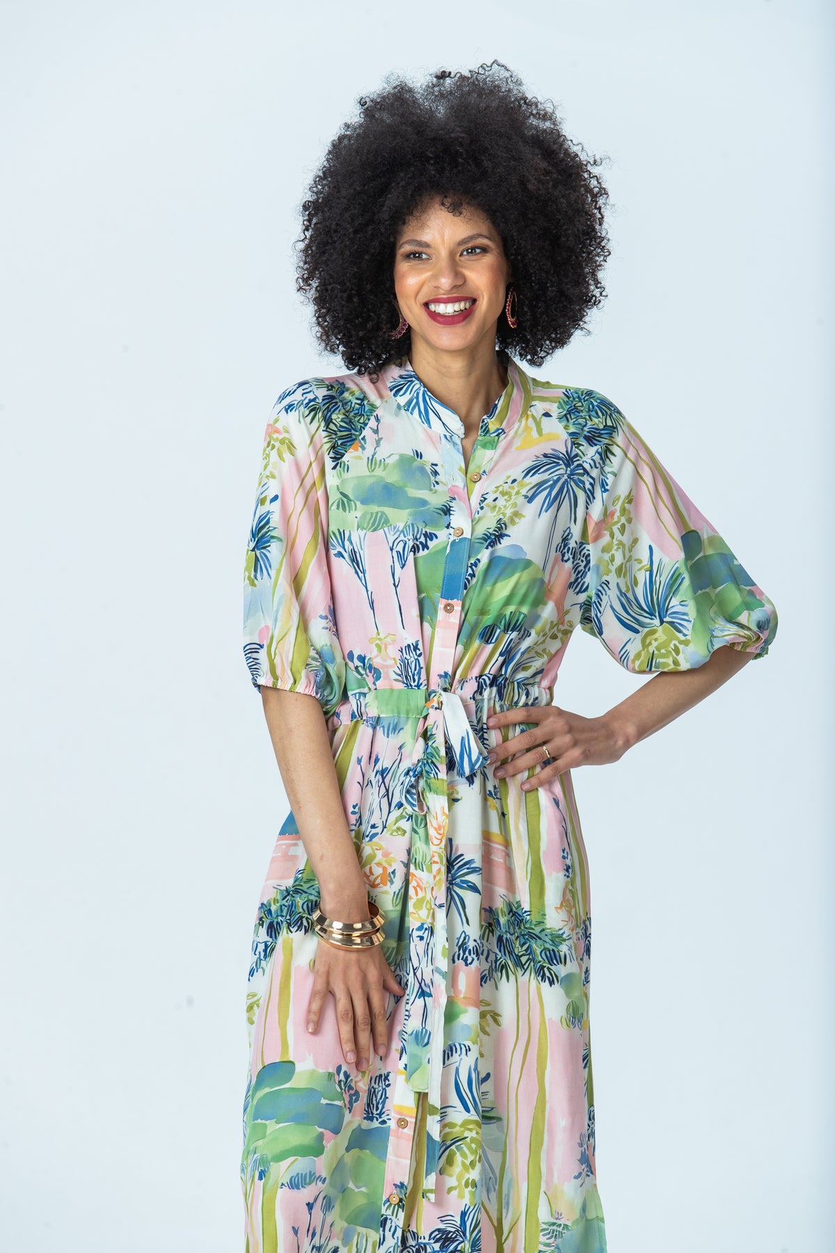 Shelby watercolour palm dress, front view with hand on hip
