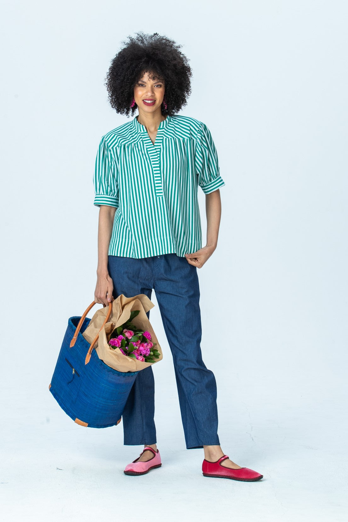 Tatum emerald stripe shirt, front view full length with a woven basket