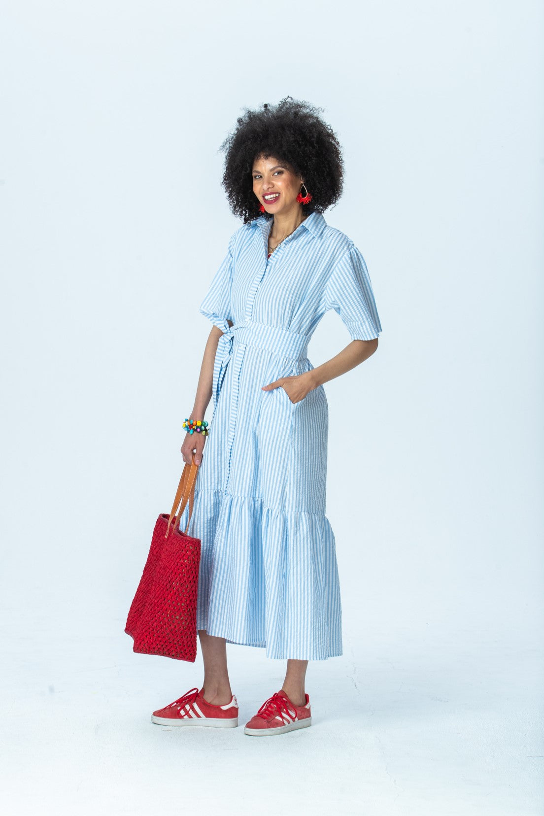Frankie blue stripe shirt dress, three-quarter view full length with hand in pocket