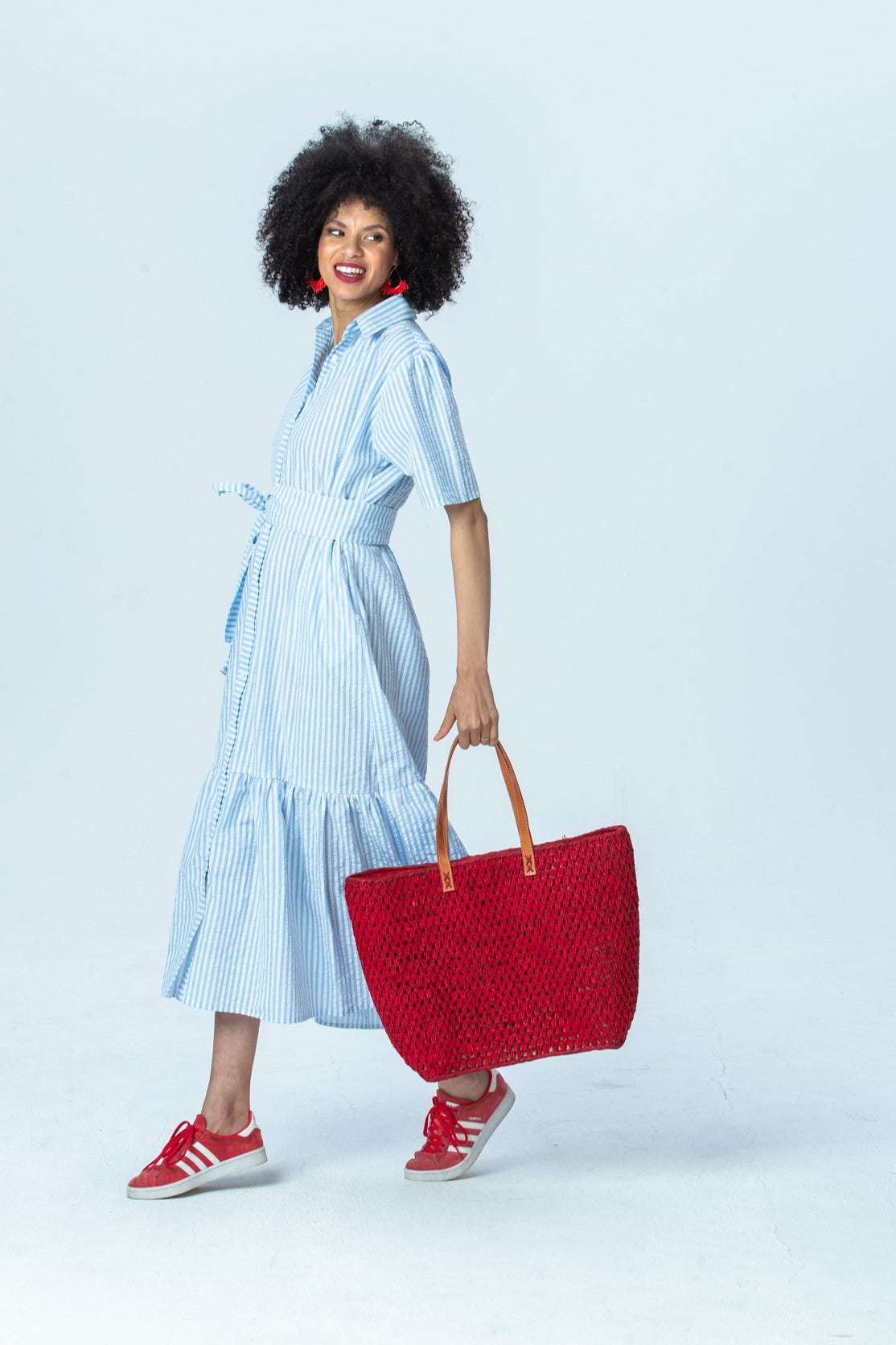 Frankie blue stripe shirt dress, side view walking, looking over the shoulder