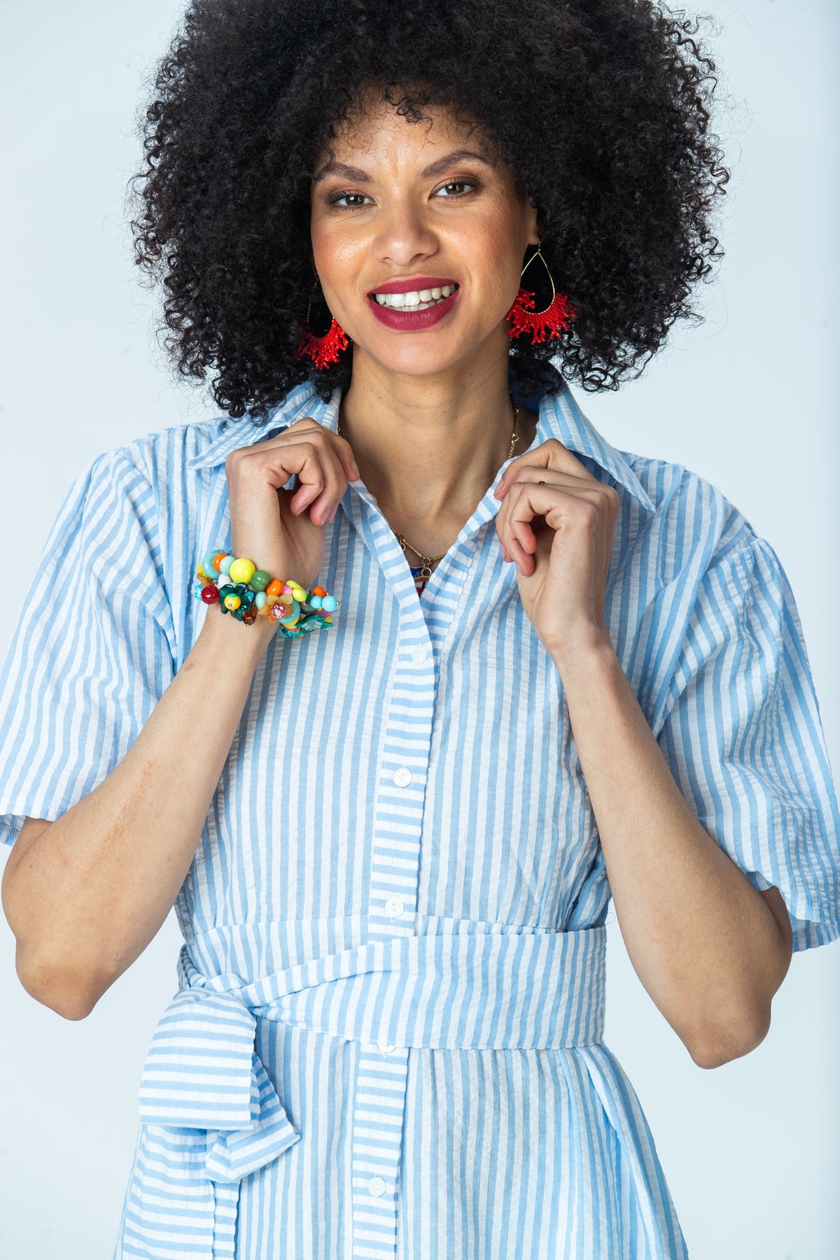 Frankie blue stripe shirt dress, close up of collar with hands at the neckline
