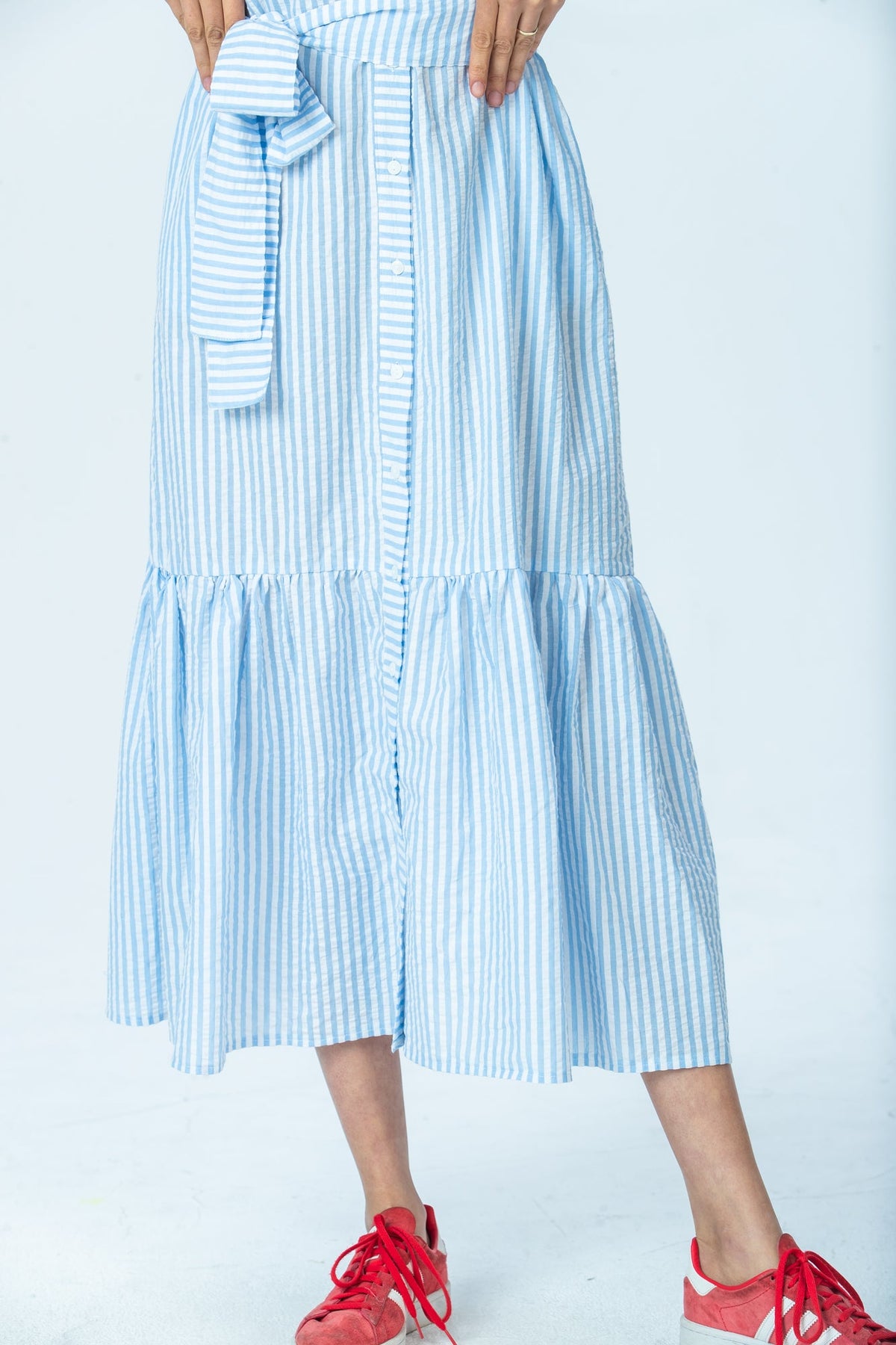 Frankie blue stripe shirt dress, close up of tiered hem and button front
