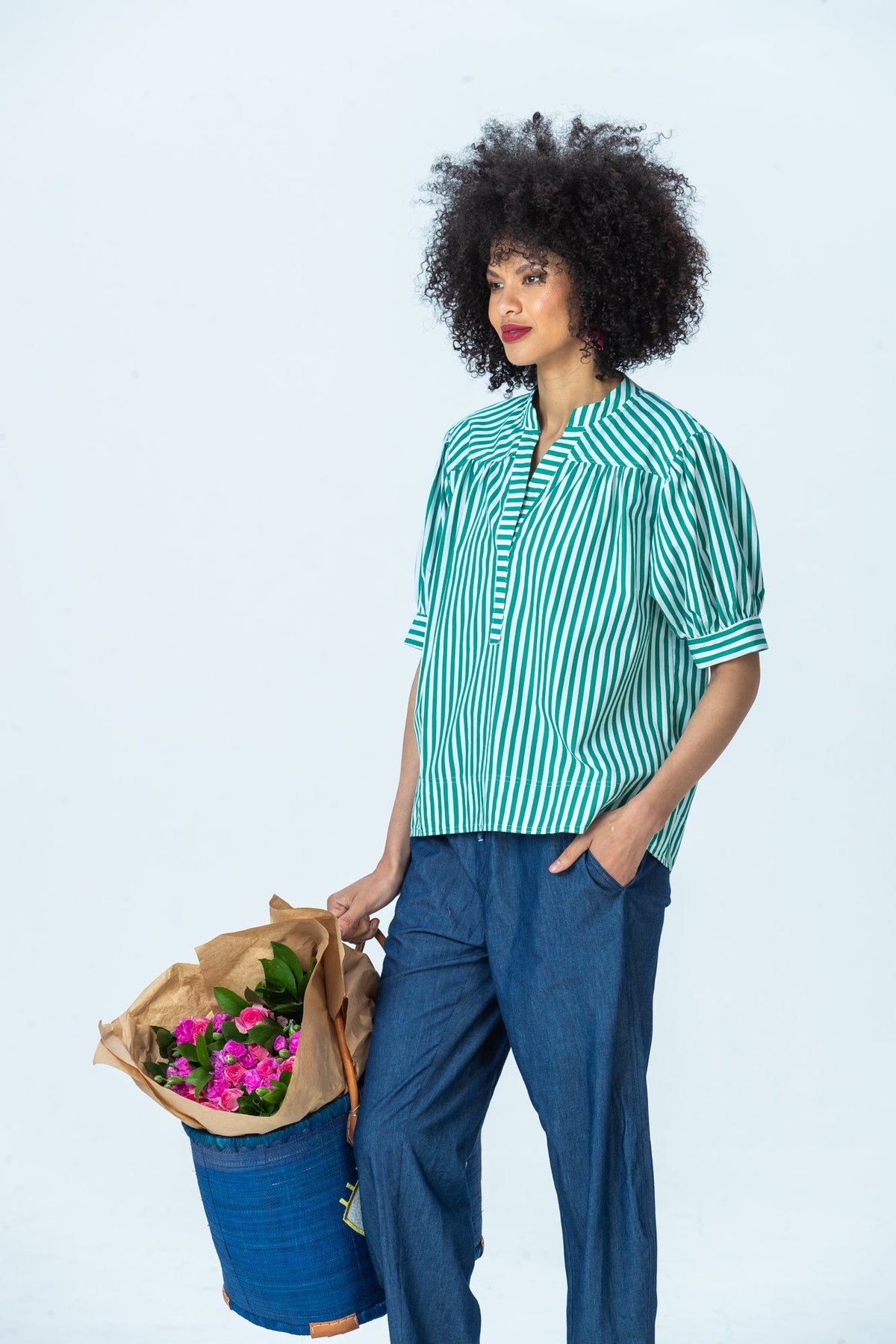 Tatum emerald stripe shirt, three-quarter view with hand in pocket