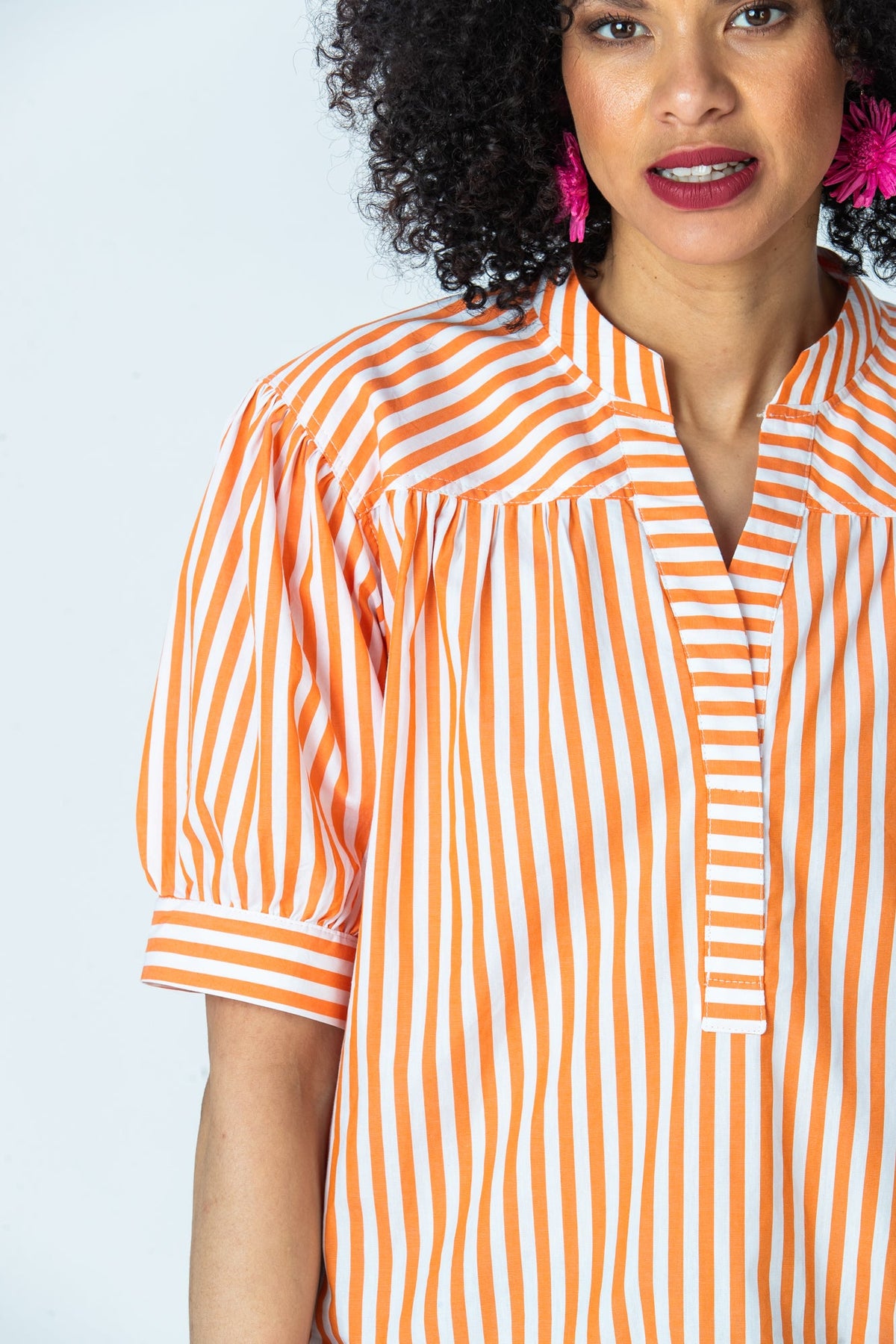 Tatum orange stripe mandarin collar shirt, close up of collar, placket and gathered sleeve