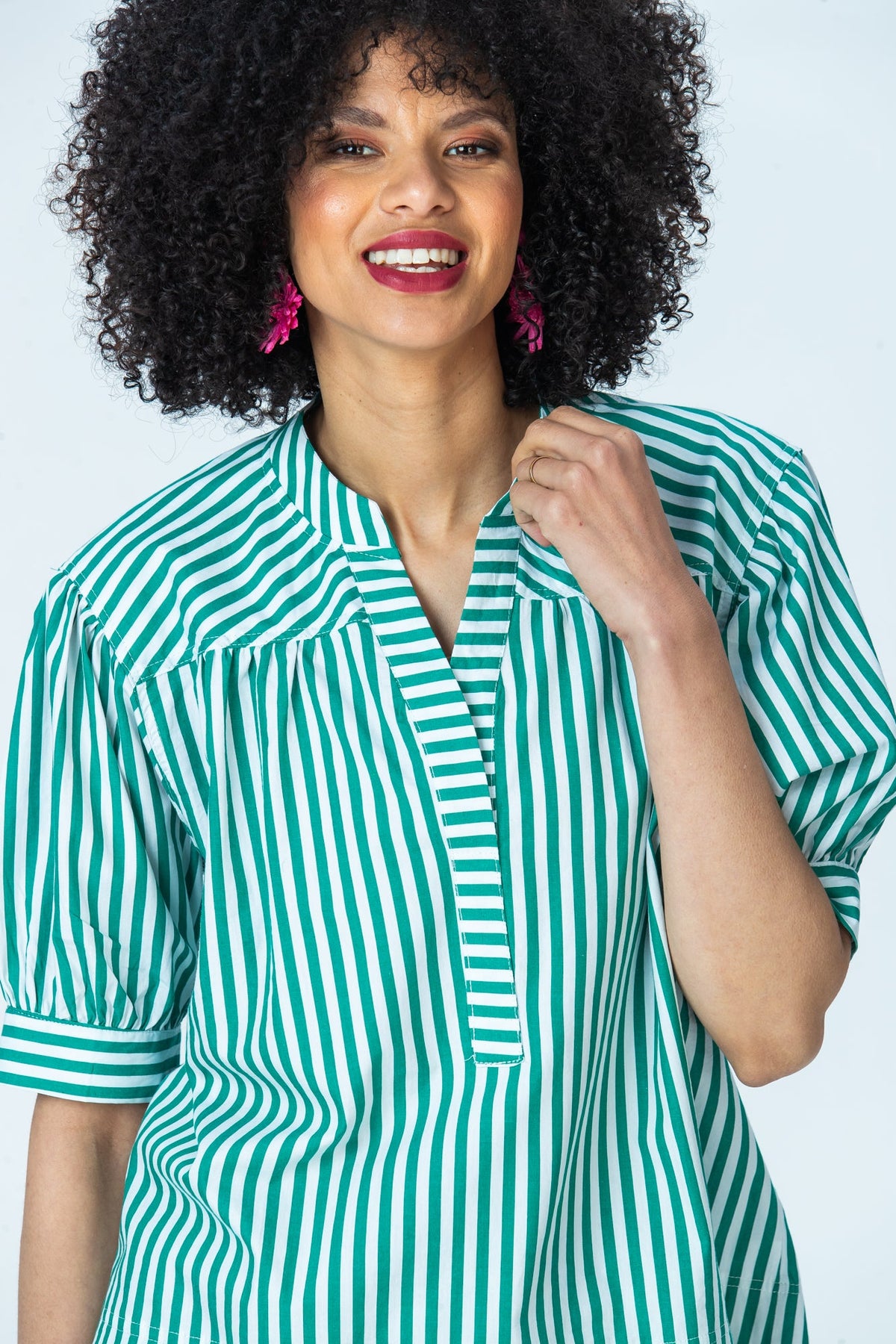 Tatum emerald stripe shirt, close up with hand at the collar