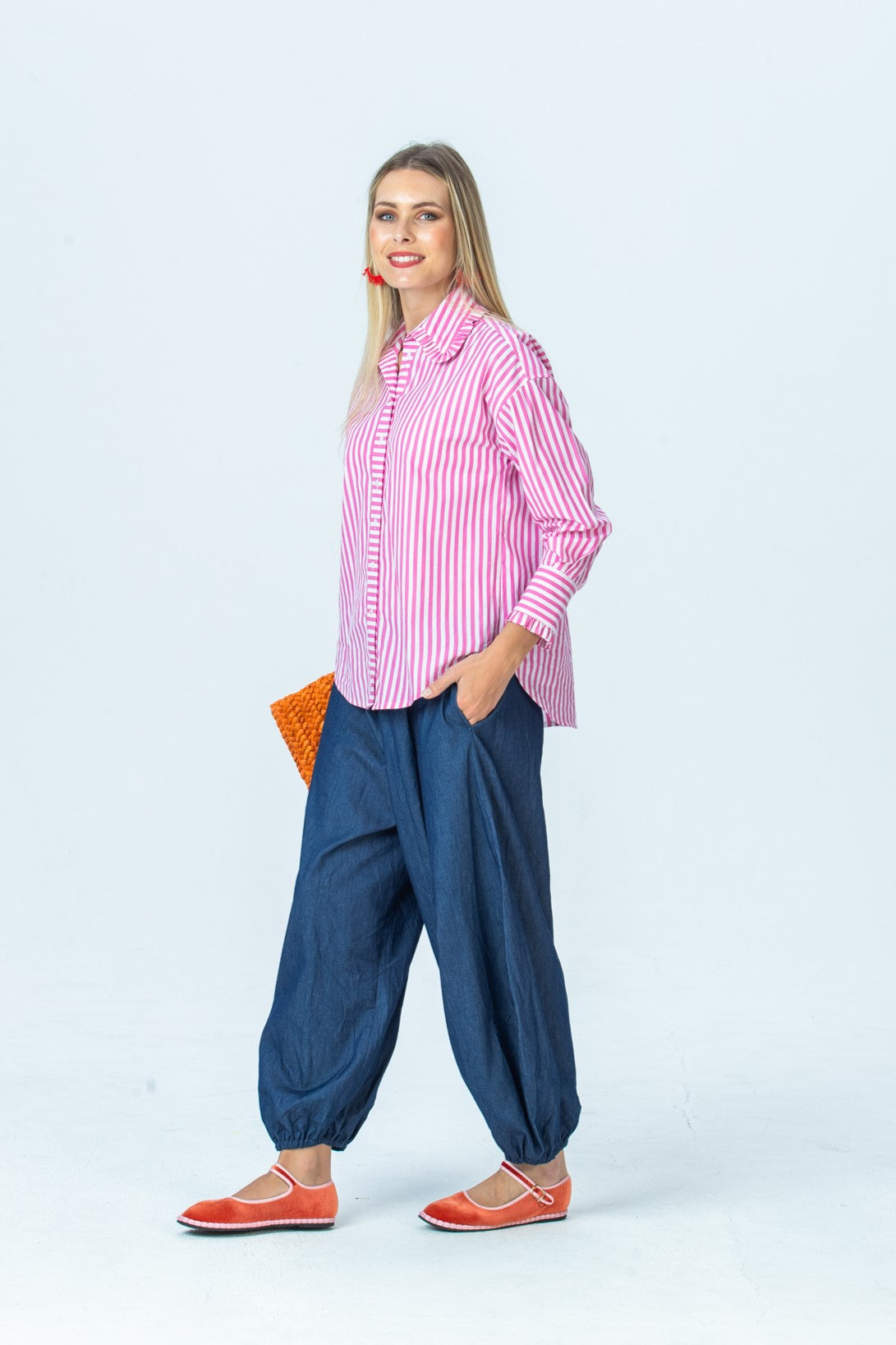 Claire frill shirt, full-length side view styled with Stella balloon pants
