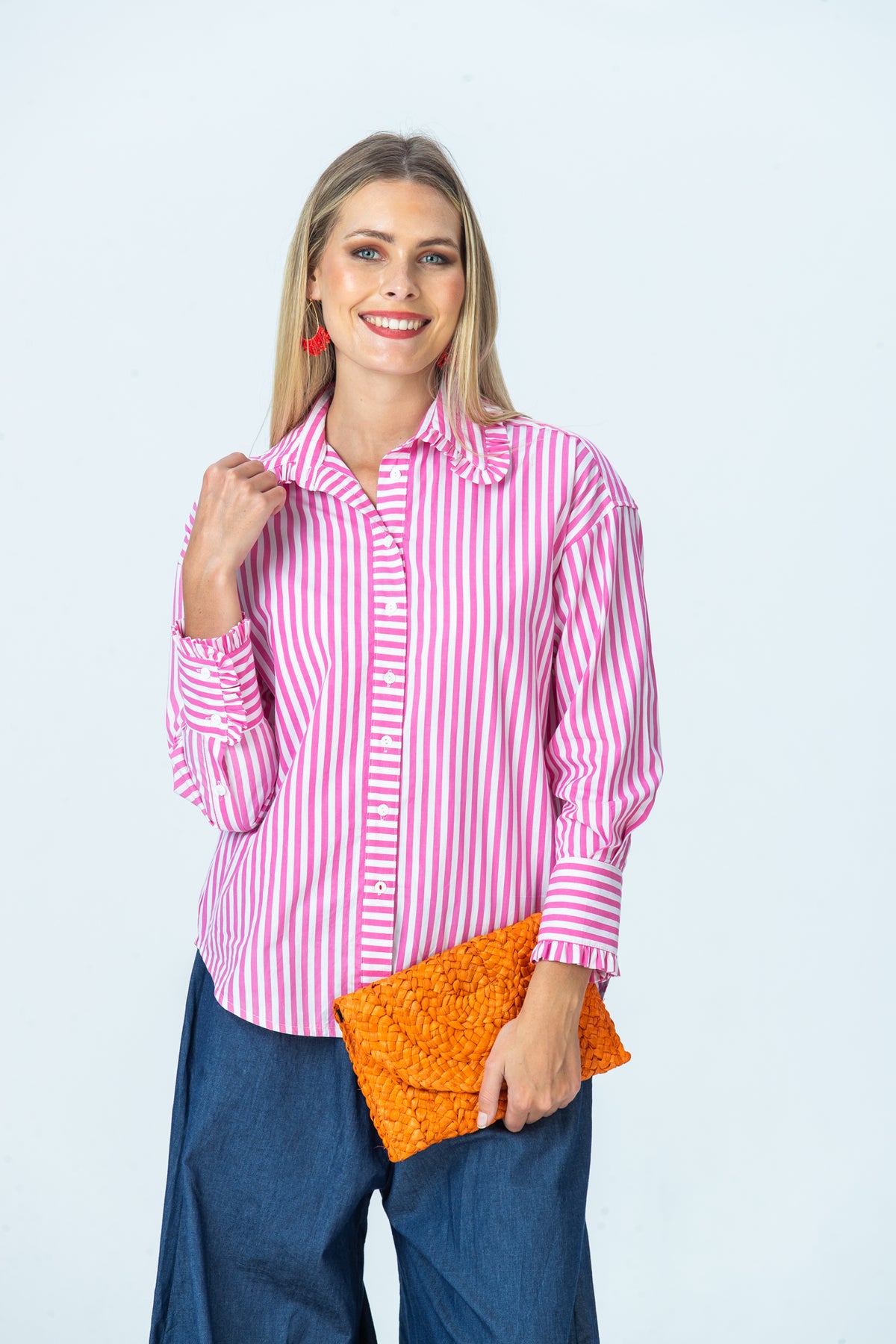 Claire frill shirt, front view with hand at collar showing buttoned frilled cuff