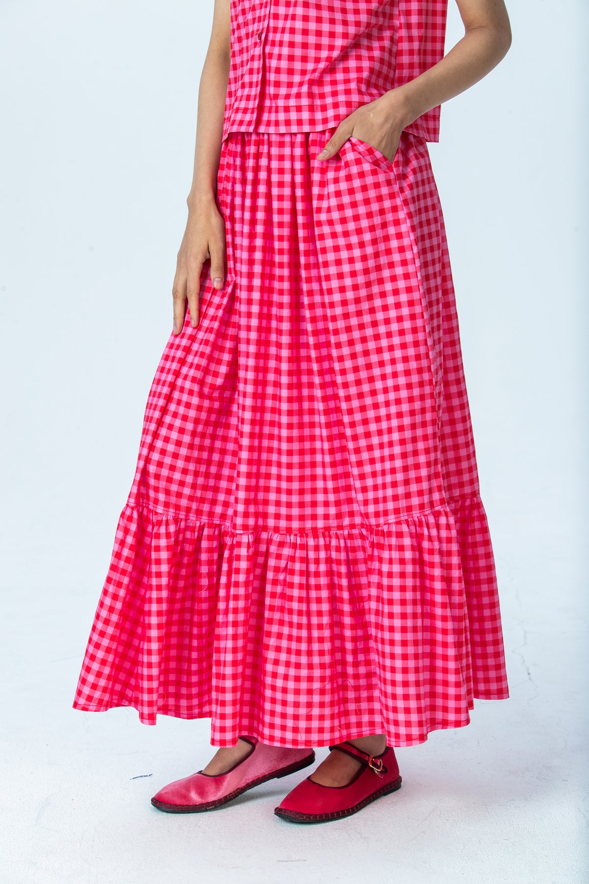 Riley red and pink check skirt, close up of tiered hem