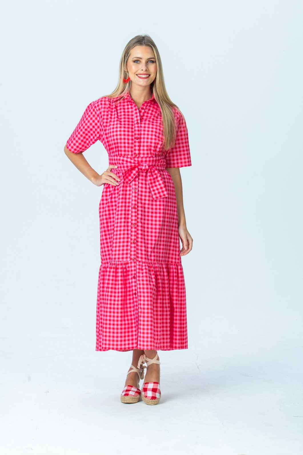 Frankie red and pink check shirt dress, front view full length with hand on hip