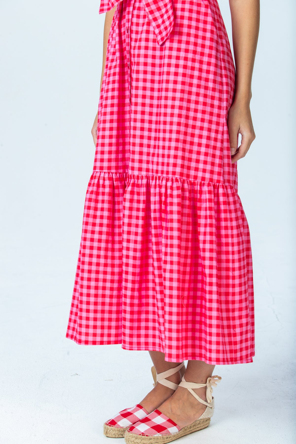 Frankie red and pink check shirt dress, close up of tiered hem