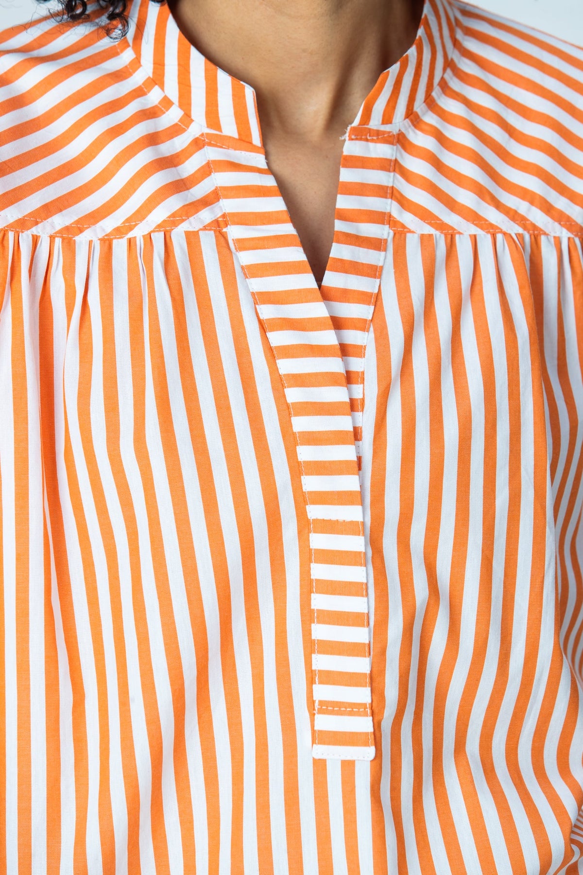 Tatum orange stripe shirt, close up of horizontal stripe placket