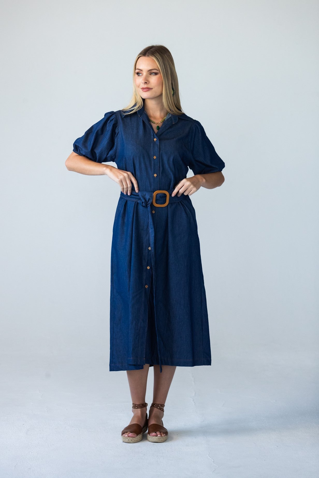 Harlow denim shirt dress in 100% cotton showing hands on belt