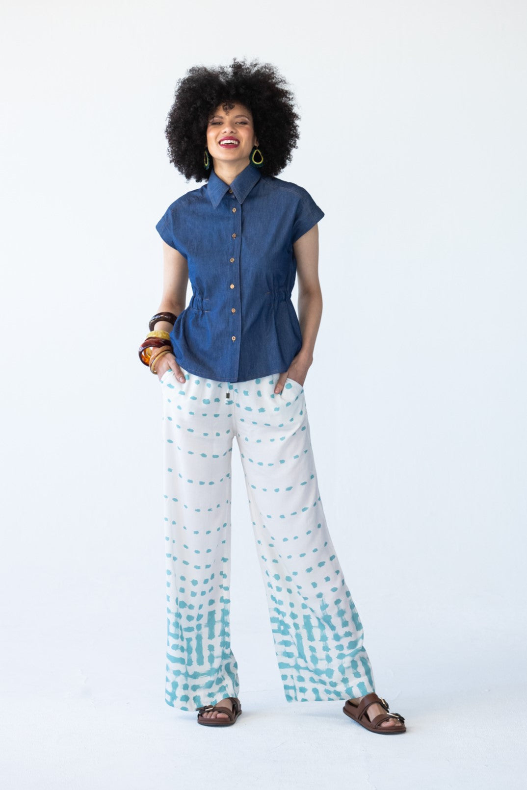 Sydney teal brushstroke wide leg pants, front view styled with denim top