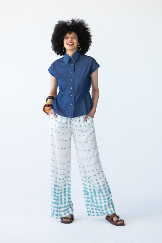 Sydney teal brushstroke wide leg pants, front view styled with denim top