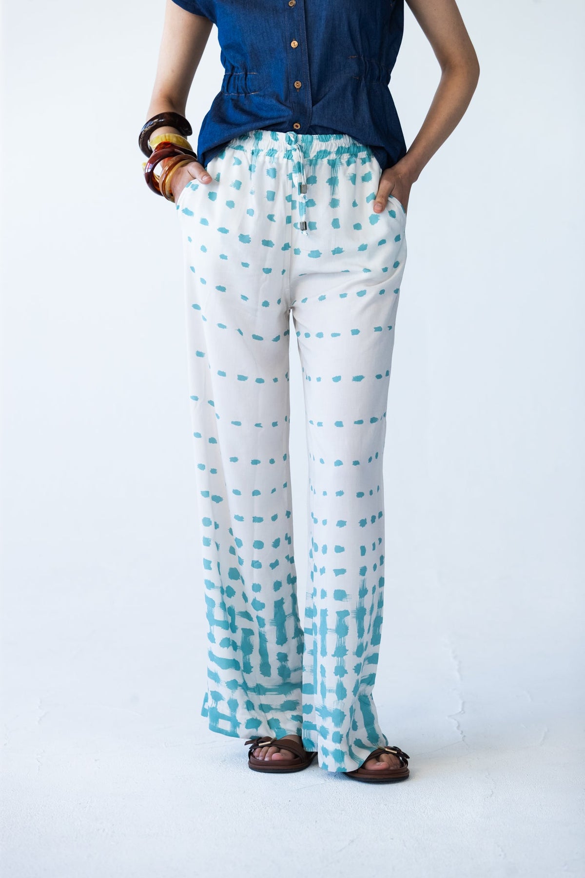 Sydney teal brushstroke wide leg pants, front view close up showing waistband