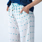 Sydney teal brushstroke wide leg pants, close up side view showing pocket and drawcord