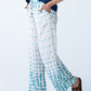 Sydney teal brushstroke wide leg pants, side profile view walking