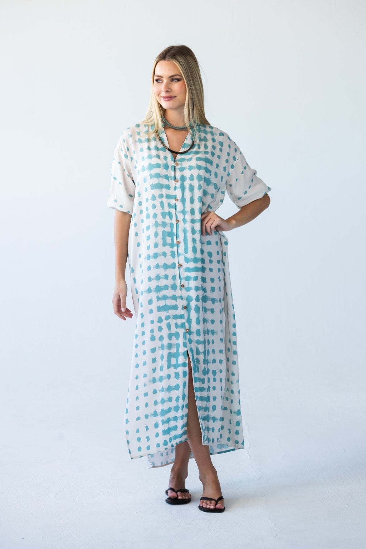 Bailey teal brushstroke kaftan, front view with hand on hip