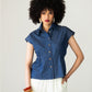 Reese denim shirt, front view with cap sleeves and belted trousers