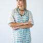 Bailey teal brushstroke kaftan, close-up front view with arms crossed