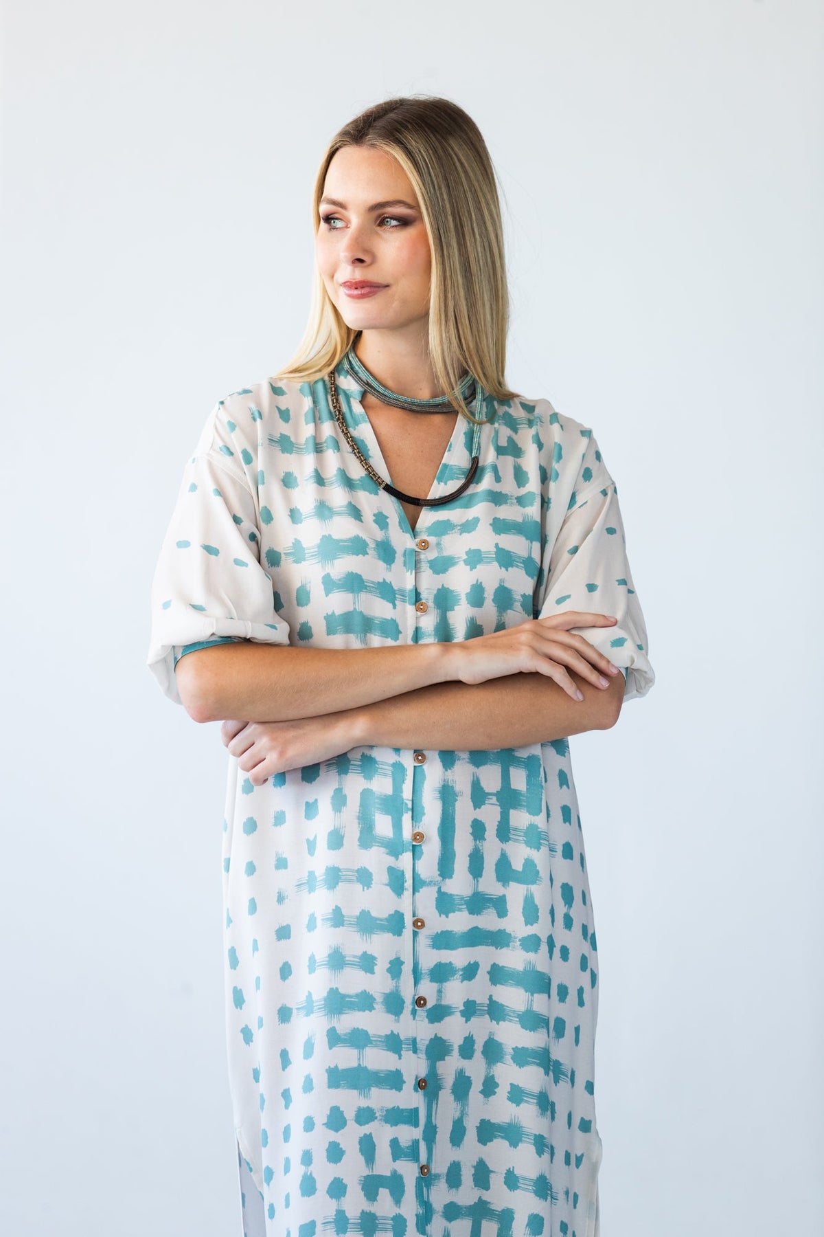 Bailey teal brushstroke kaftan, close-up front view with arms crossed