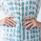 Bailey teal brushstroke kaftan, close-up of button placket