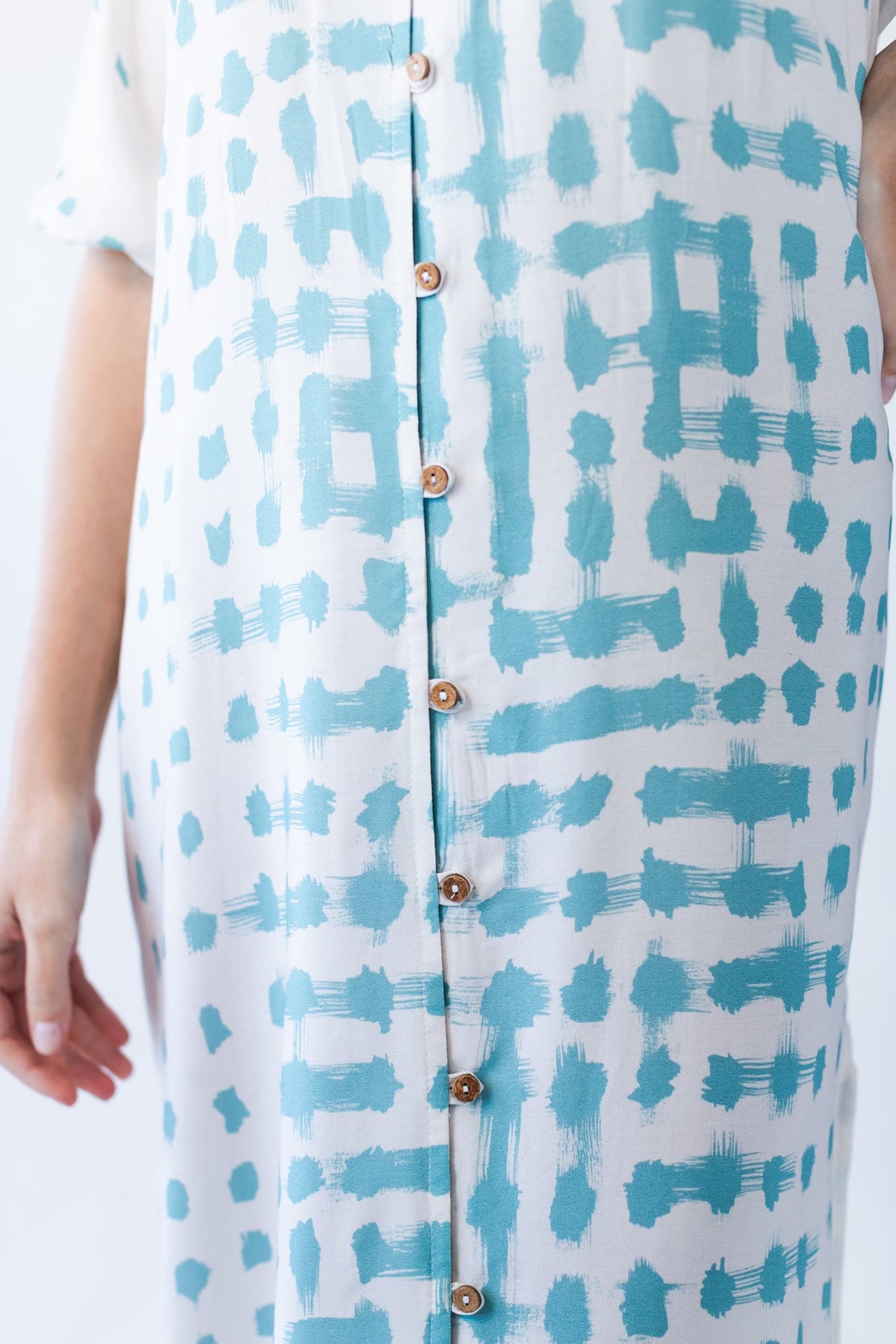Bailey teal brushstroke kaftan, close-up of button placket and print detail